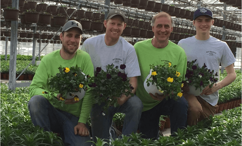 The Miller family in the greenhouse